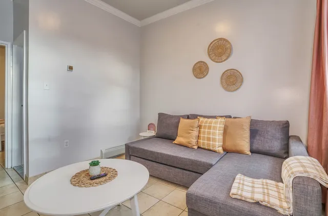 a living room with furniture and a couch