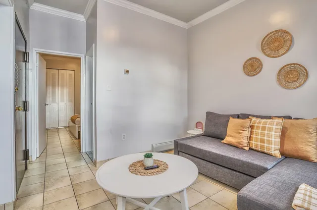 a living room with furniture and a table