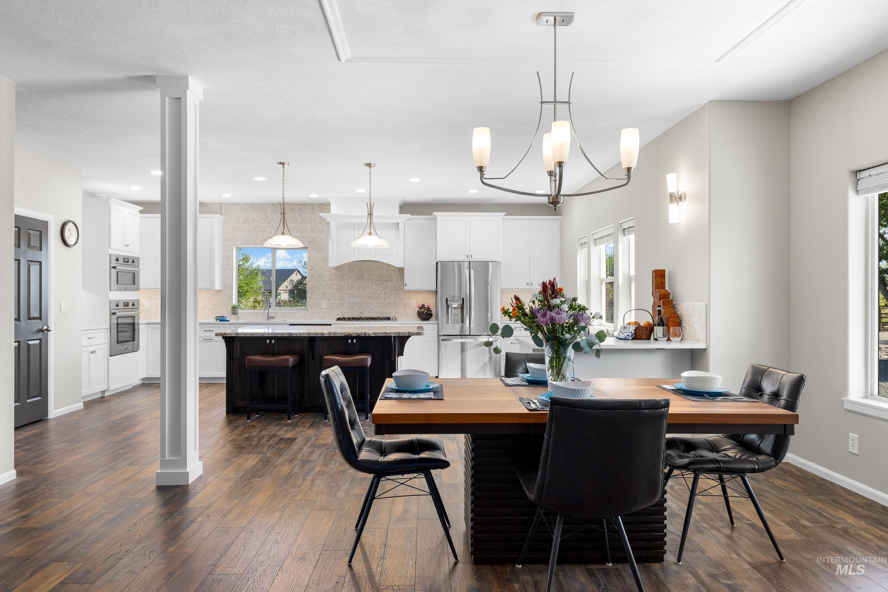 14119 Silver Ridge Road Caldwell, ID 83607 - Photo 14 of 50 Dining room with dark wood-style flooring, a chandelier, and recessed lighting