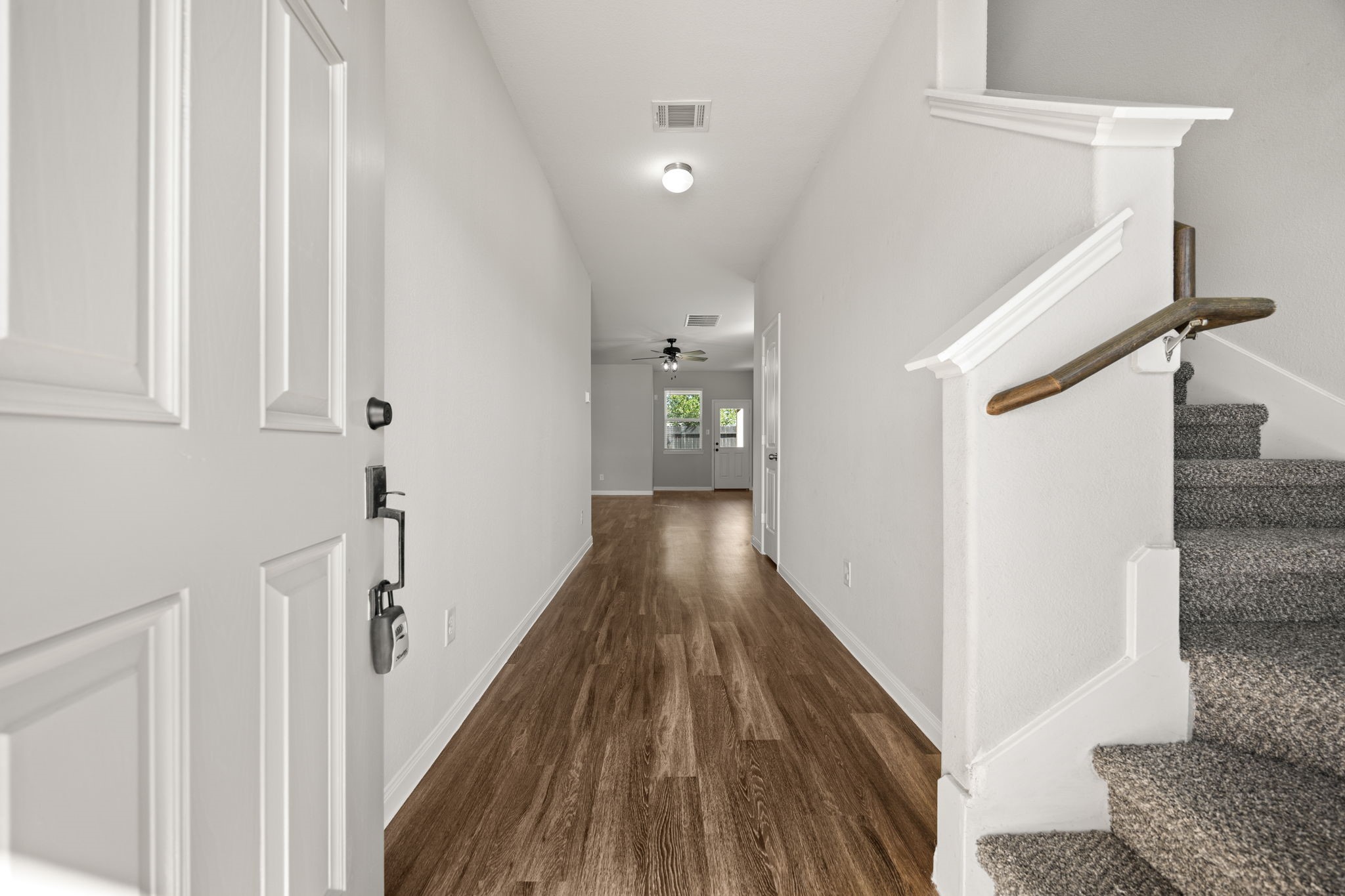 18606 Lansdowne Stream Path Katy, TX 77449 - Photo 9 of 39 a view of a hallway with wooden floor and staircase