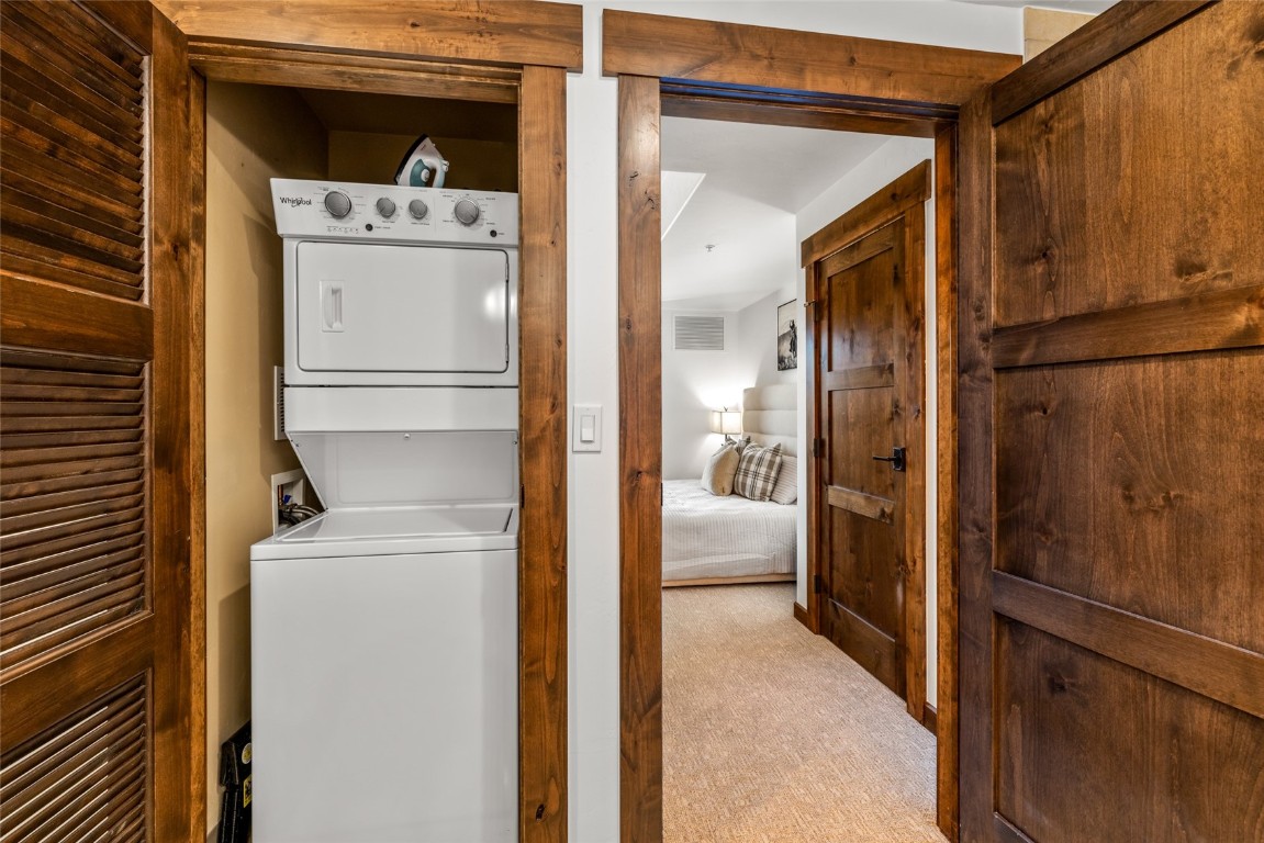 1175 Bangtail Way, Unit 2106 Steamboat Springs, CO 80487 - Photo 17 of 32 a view of a storage & utility room with washer and dryer