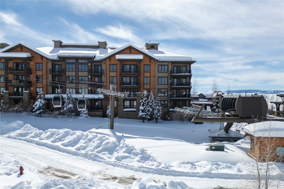 1175 Bangtail Way, Unit 2106 Steamboat Springs, CO 80487 - Photo 27 of 32 a view of a chairs and tables in the patio