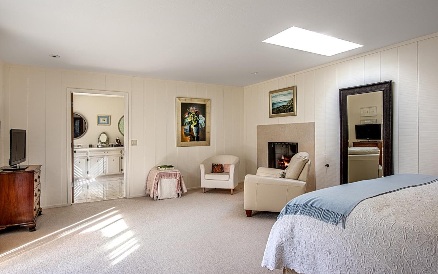 3048 Larkin Road Pebble Beach, CA 93953 - Photo 14 of 24 a bedroom with bed and a couch