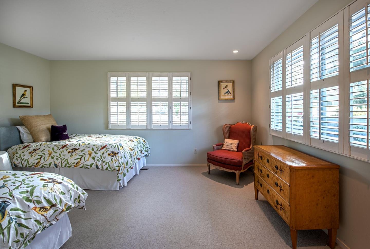 3048 Larkin Road Pebble Beach, CA 93953 - Photo 17 of 24 a bedroom with bed and a couch