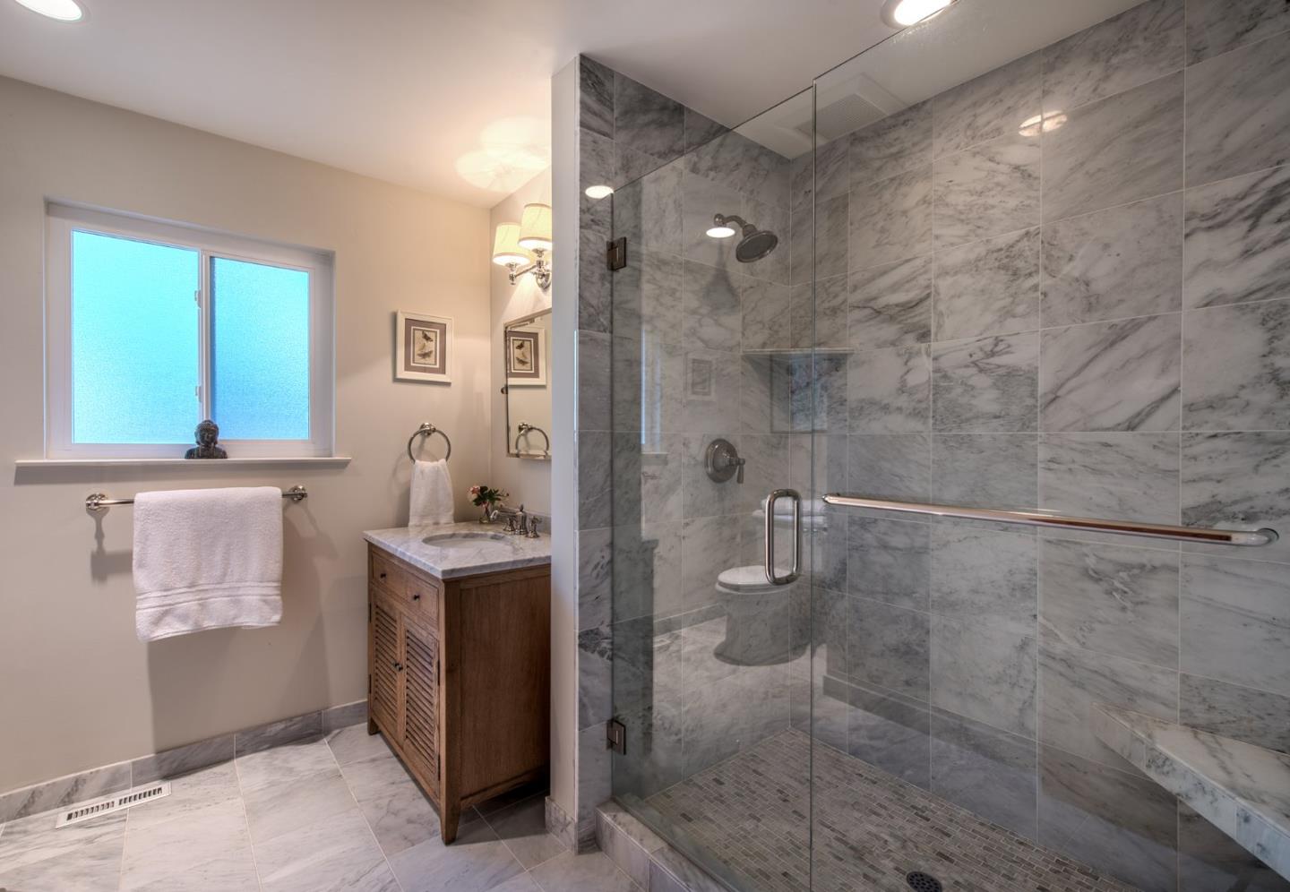 3048 Larkin Road Pebble Beach, CA 93953 - Photo 18 of 24 a bathroom with a sink a toilet and shower