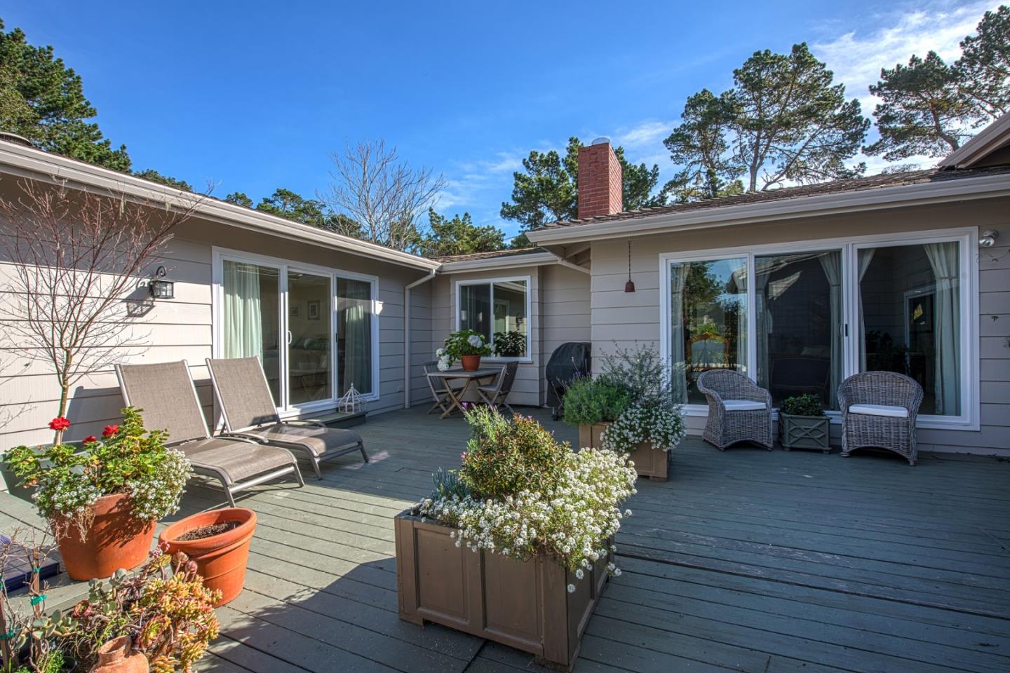 3048 Larkin Road Pebble Beach, CA 93953 - Photo 23 of 24 a house view with a seating space and garden space