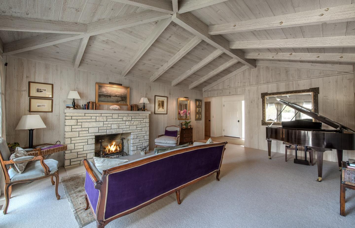 3048 Larkin Road Pebble Beach, CA 93953 - Photo 4 of 24 a living room with furniture and a fireplace
