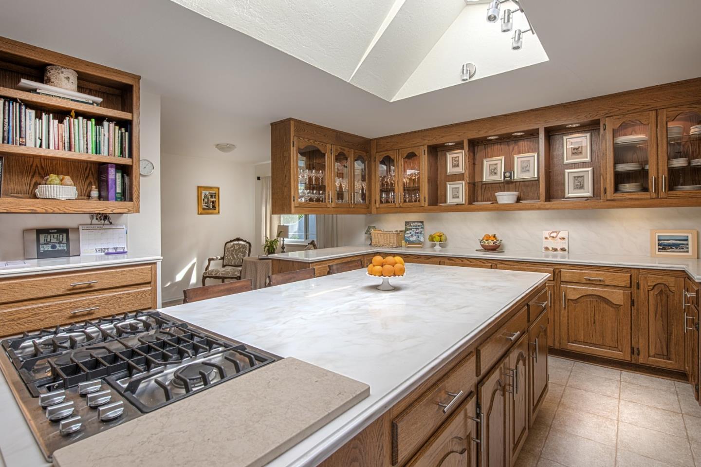 3048 Larkin Road Pebble Beach, CA 93953 - Photo 7 of 24 a kitchen with stainless steel appliances granite countertop a stove and a sink