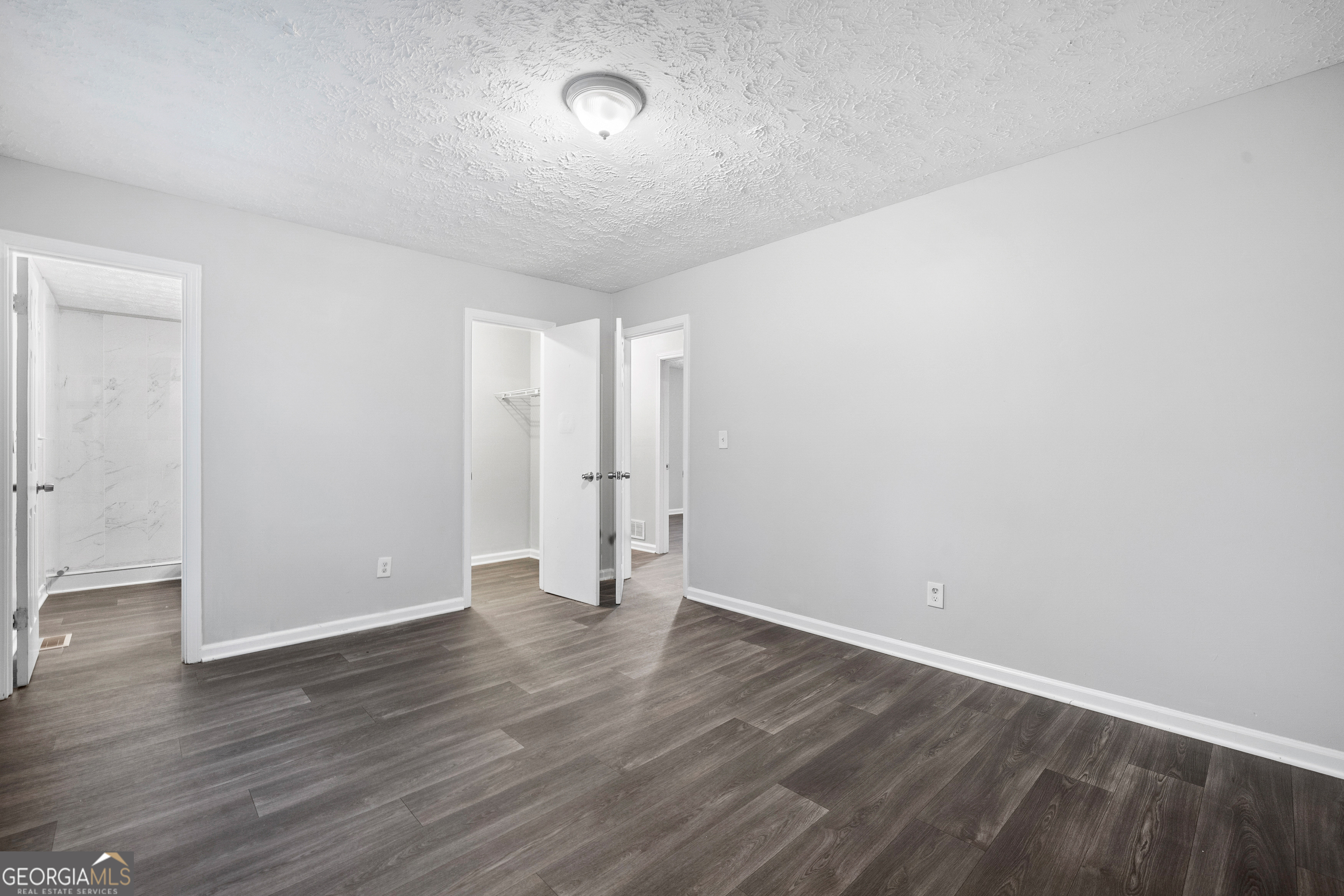6155 Pointer Way Douglasville, GA 30135 - Photo 13 of 26 a view of an empty room with wooden floor