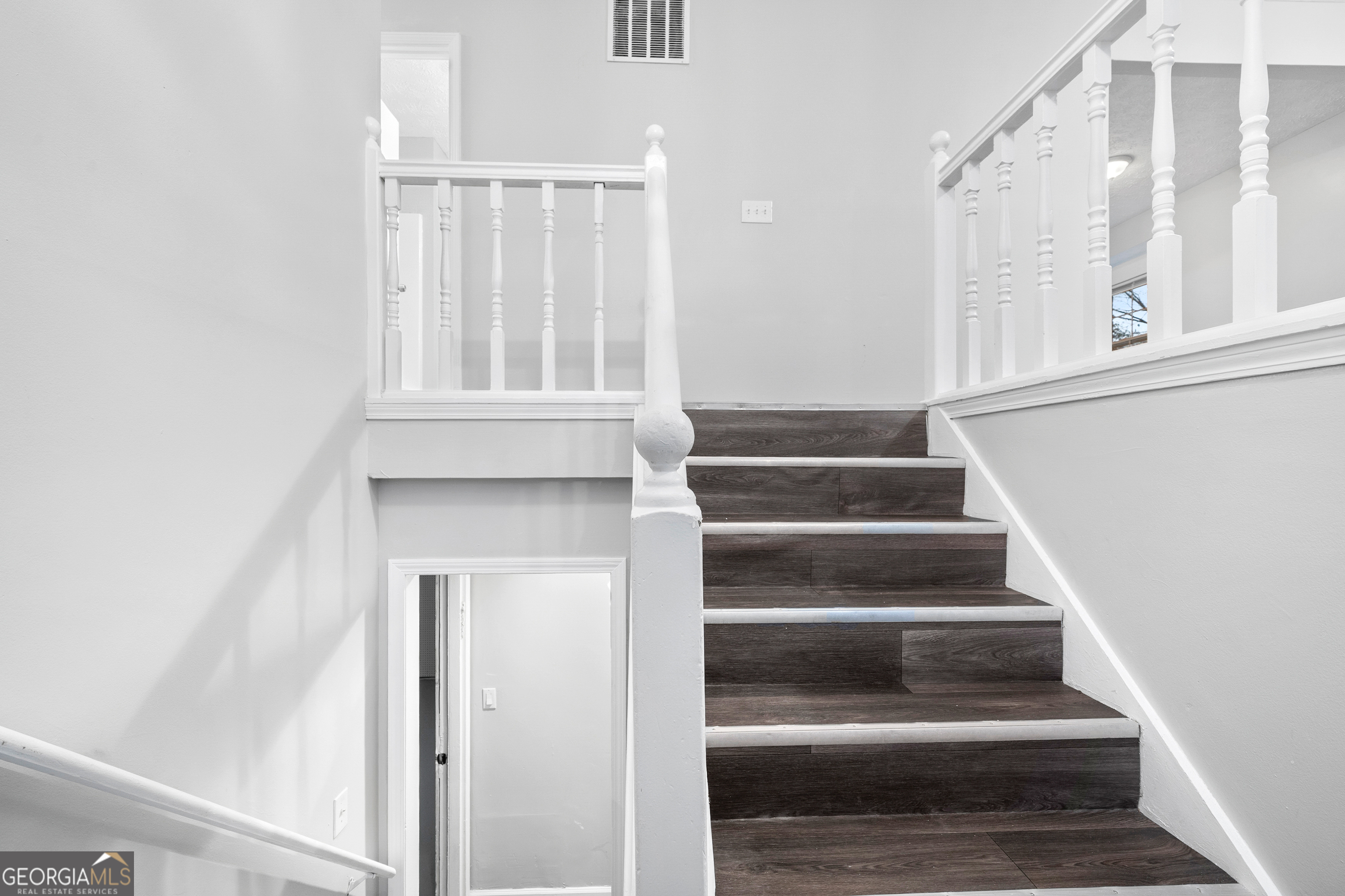 6155 Pointer Way Douglasville, GA 30135 - Photo 15 of 26 a view of staircase with white walls and a window