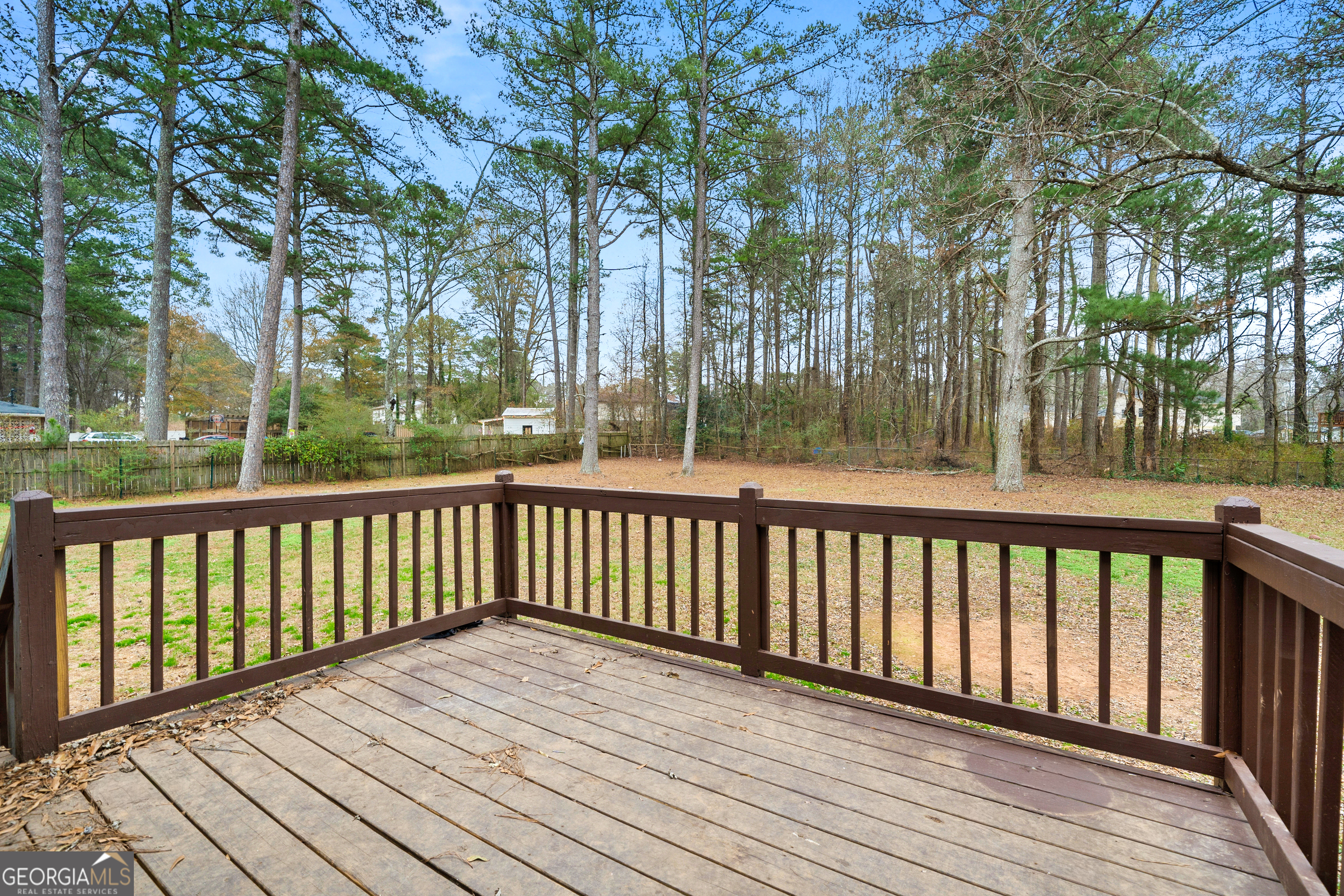 6155 Pointer Way Douglasville, GA 30135 - Photo 24 of 26 a balcony with wooden floor and fence