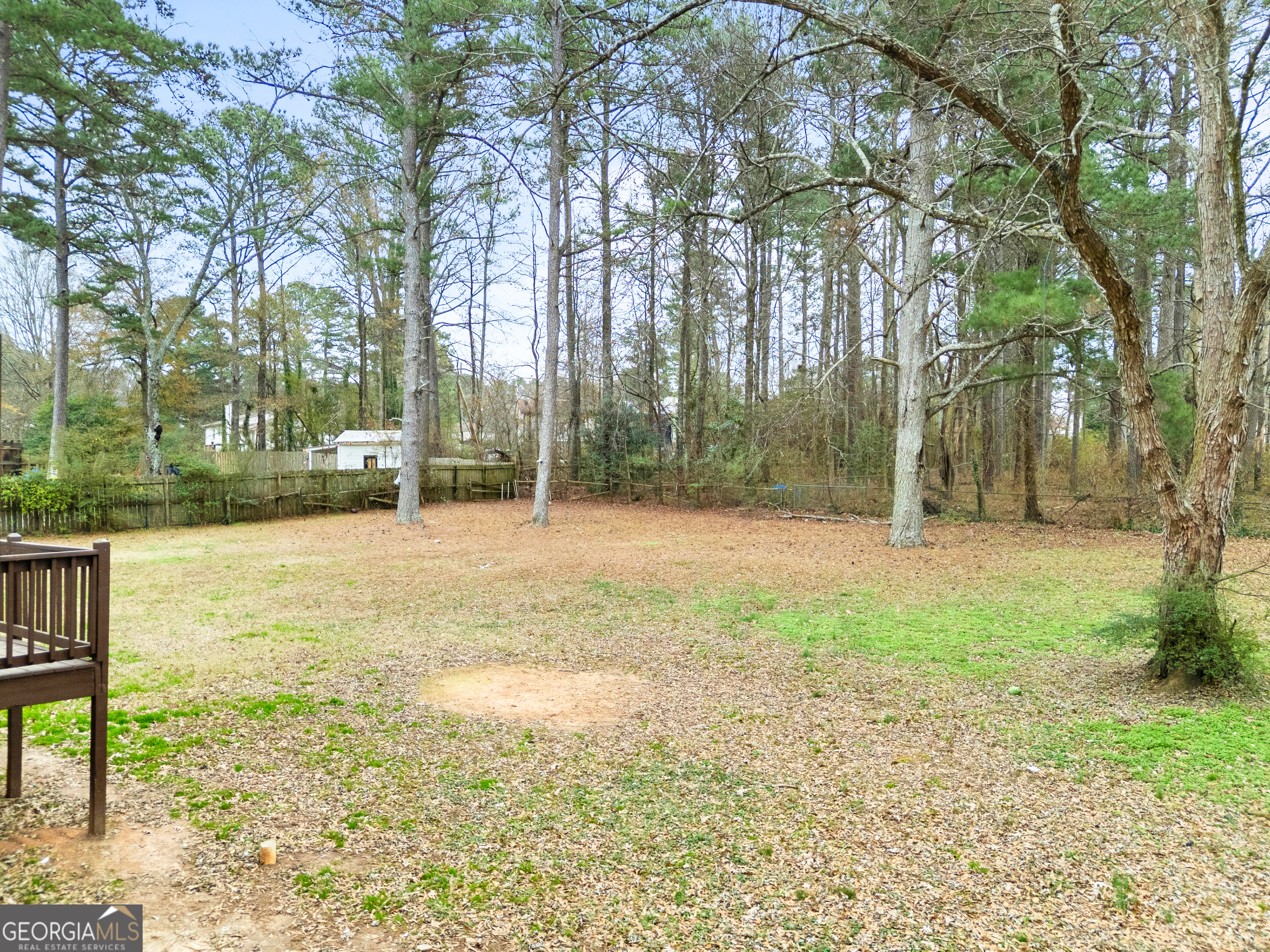 6155 Pointer Way Douglasville, GA 30135 - Photo 26 of 26 a backyard of a house with lots of green space and fountain