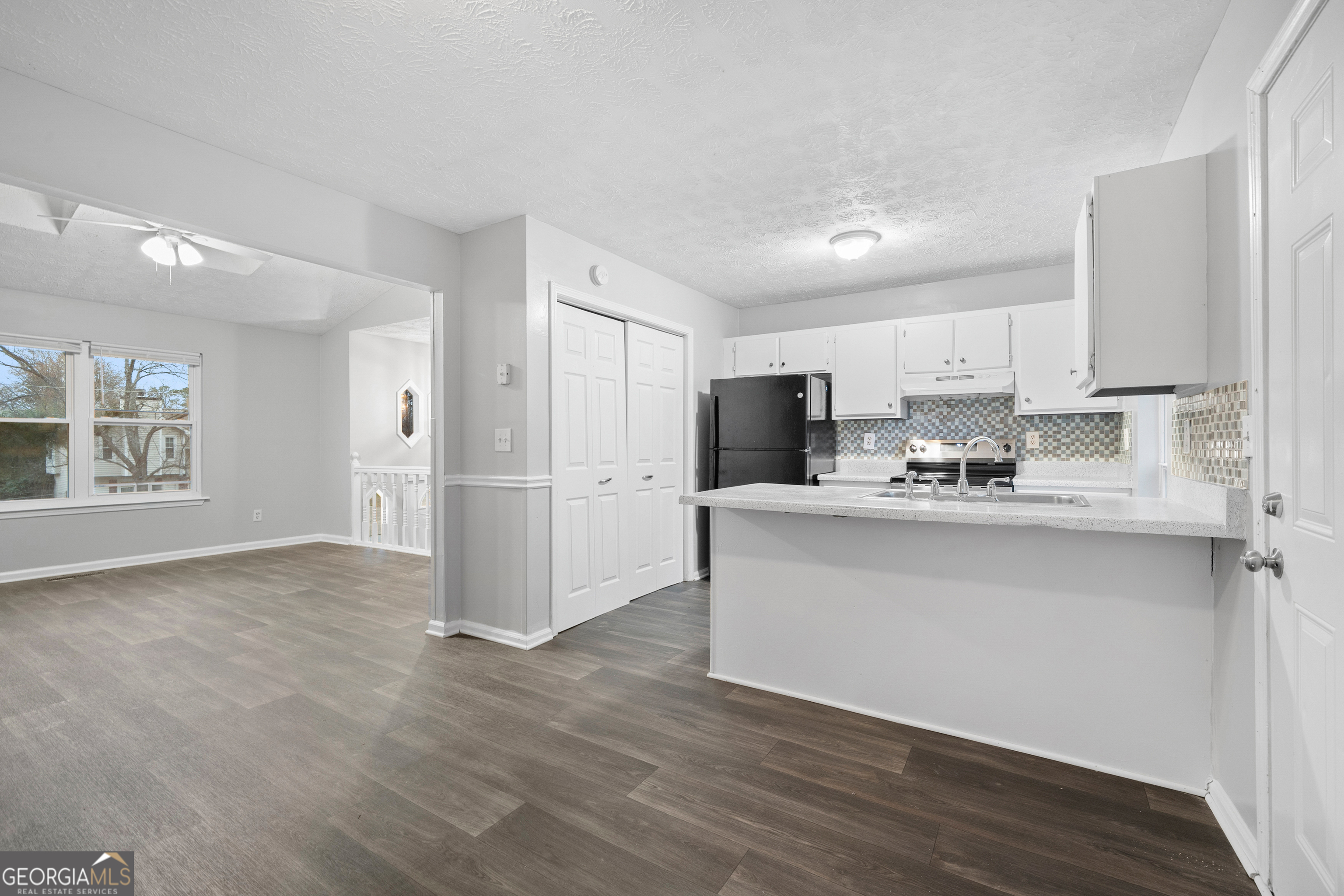6155 Pointer Way Douglasville, GA 30135 - Photo 5 of 26 a view of kitchen with stainless steel appliances refrigerator stove microwave and cabinets