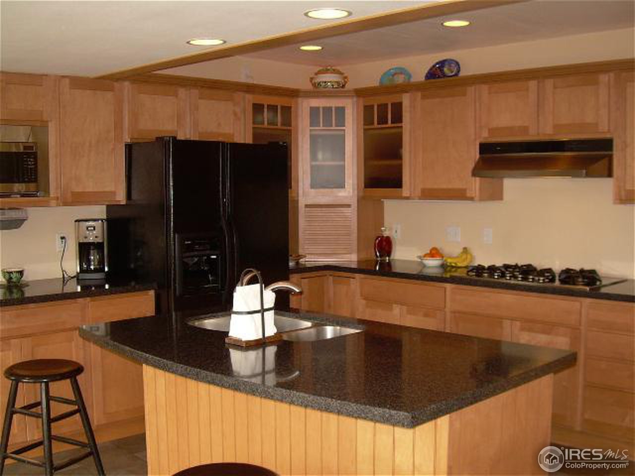 7701 O Connor Road Boulder, CO 80303 - Photo 5 of 18 a kitchen with granite countertop a sink a stove and refrigerator