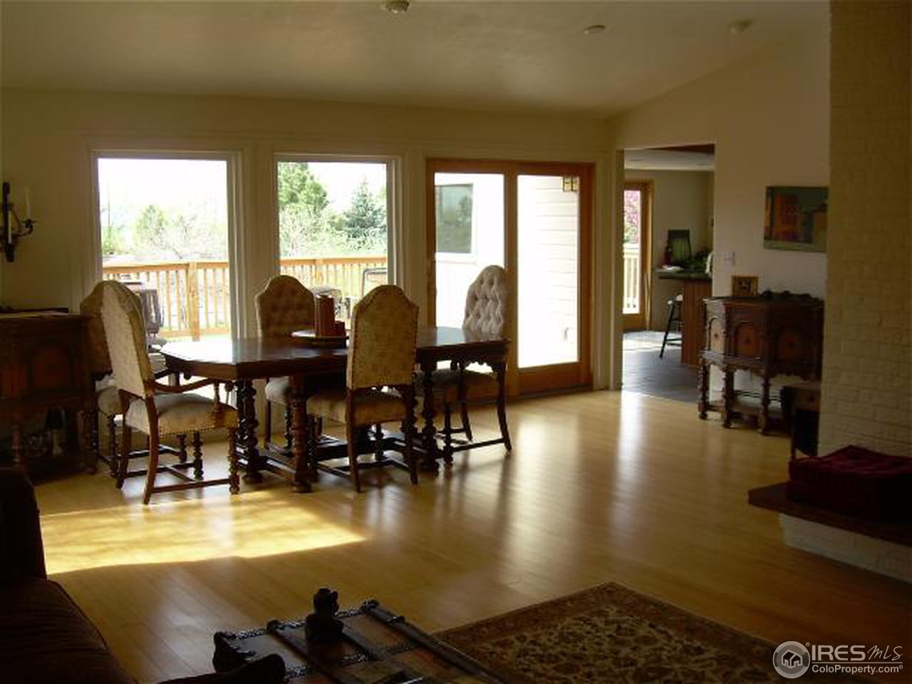 7701 O Connor Road Boulder, CO 80303 - Photo 7 of 18 a view of a dining room with furniture window and wooden floor