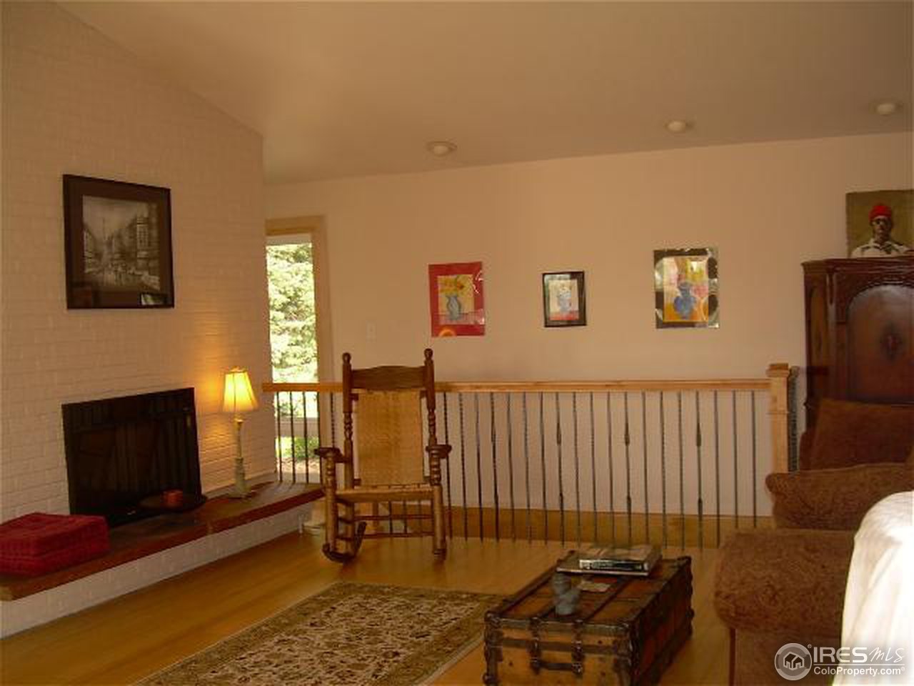 7701 O Connor Road Boulder, CO 80303 - Photo 9 of 18 a living room with furniture a fireplace and a flat screen tv