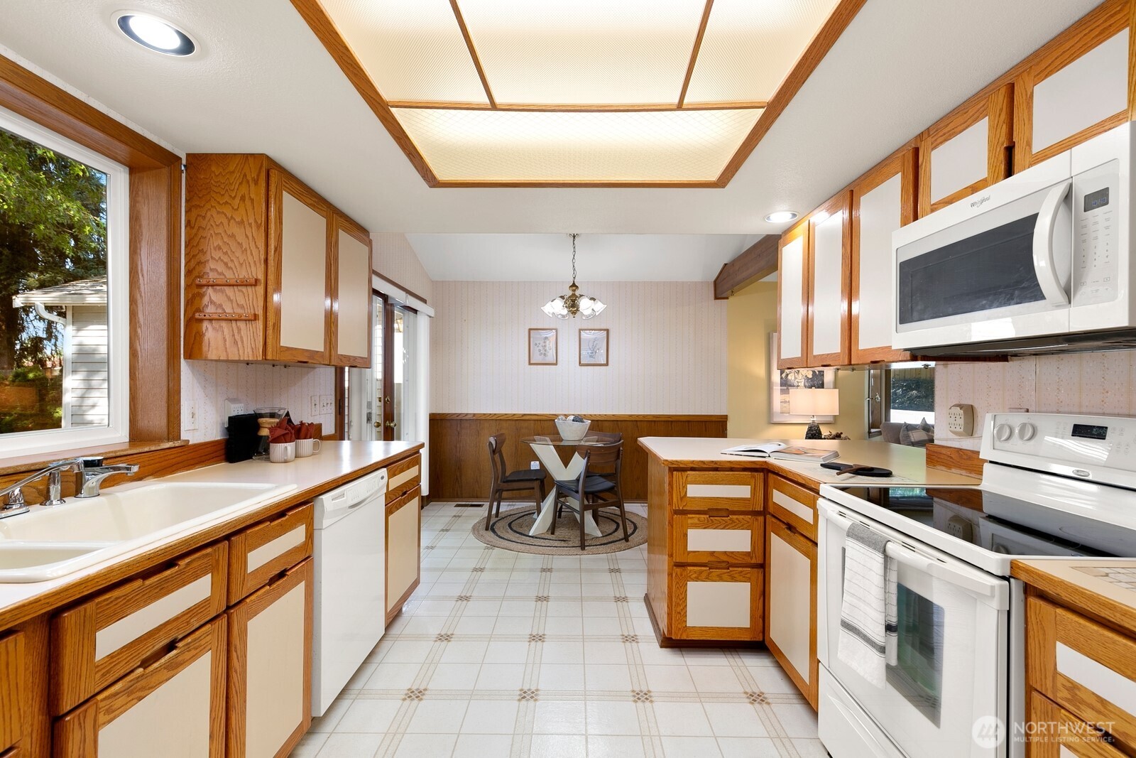 3908 Northeast 10th Street Renton, WA 98056 - Photo 13 of 29 a kitchen with a sink stove and cabinets