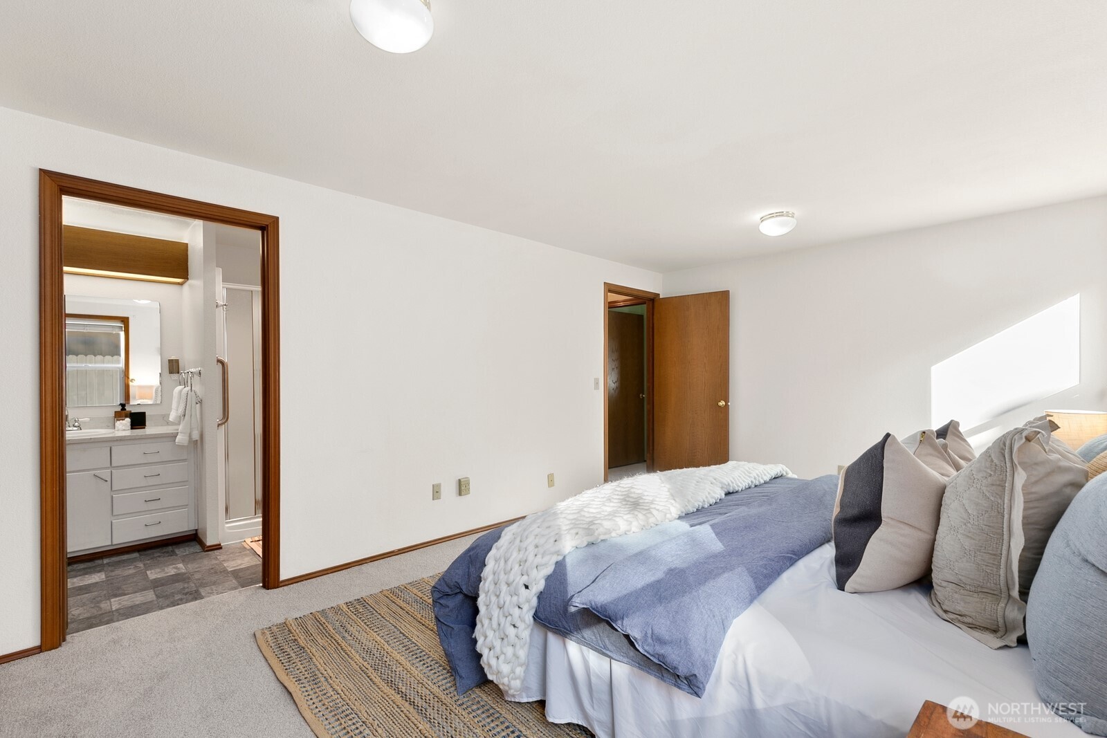 3908 Northeast 10th Street Renton, WA 98056 - Photo 15 of 29 a bedroom with a bed and walk in closet