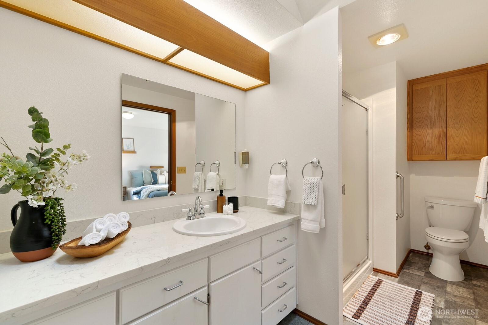 3908 Northeast 10th Street Renton, WA 98056 - Photo 16 of 29 a bathroom with a sink a toilet and shower