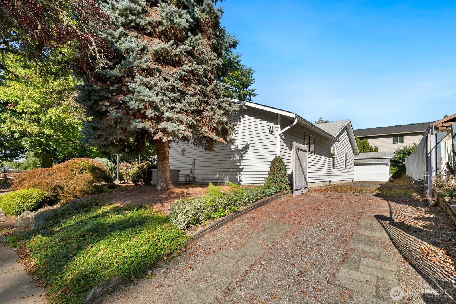 3908 Northeast 10th Street Renton, WA 98056 - Photo 28 of 29 a view of a house with a yard and pathway