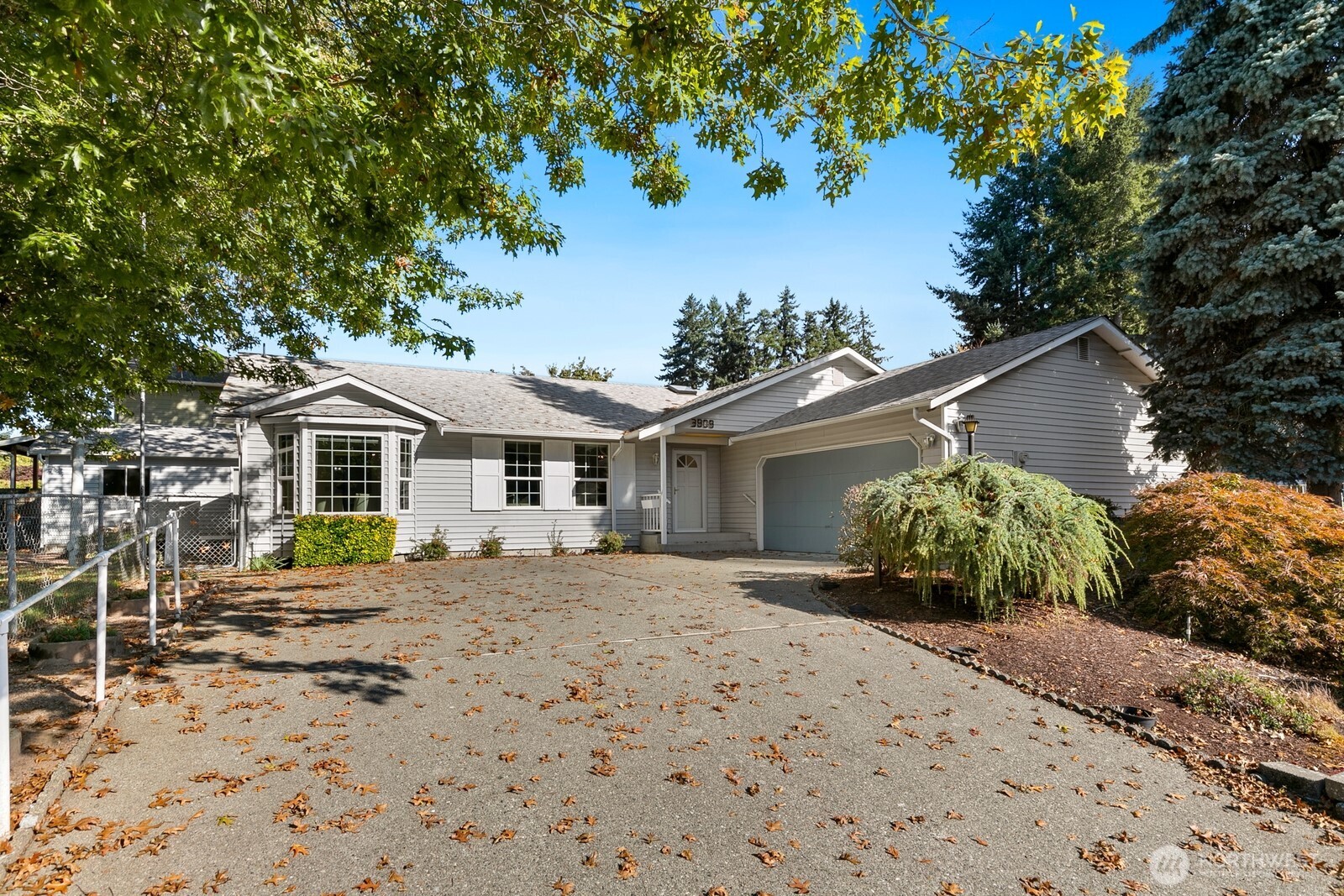 3908 Northeast 10th Street Renton, WA 98056 - Photo 29 of 29 a house with a bench in front of house