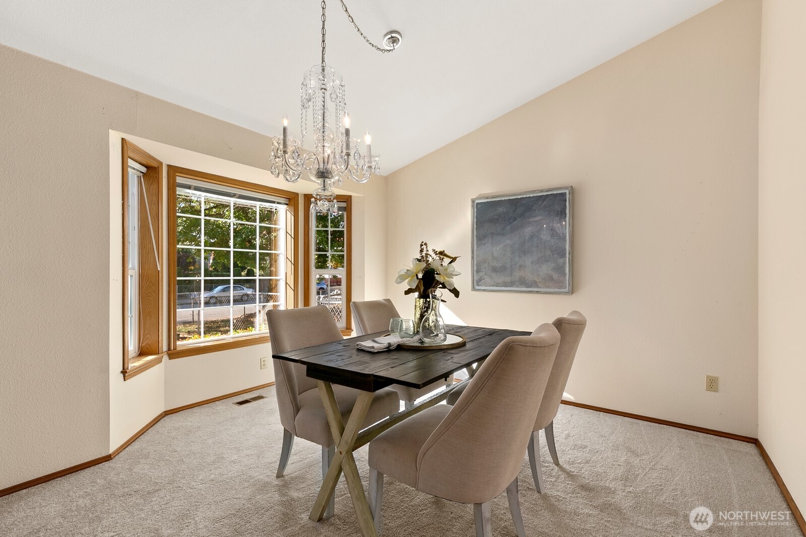 3908 Northeast 10th Street Renton, WA 98056 - Photo 4 of 29 a dining room with furniture a chandelier and window