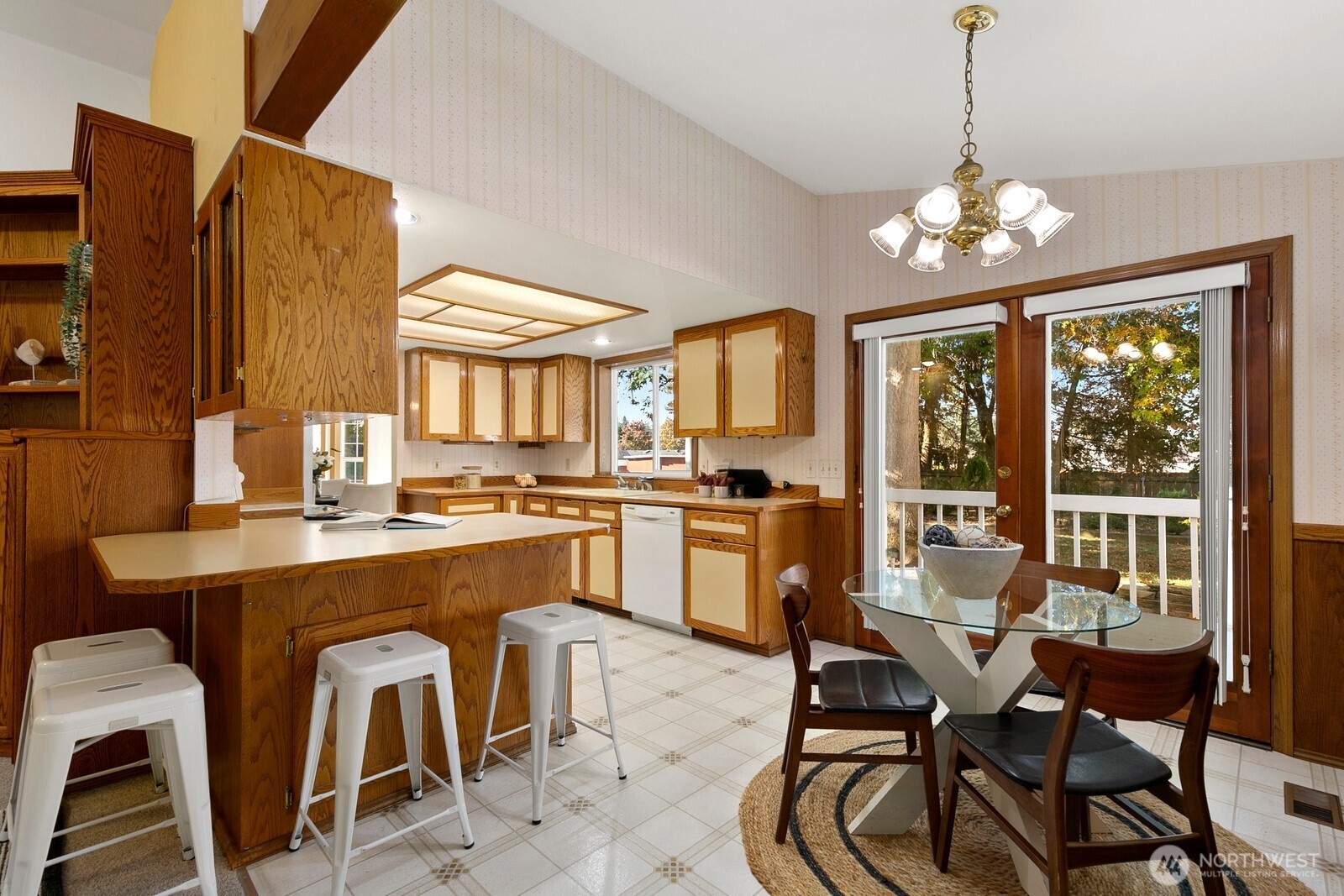 3908 Northeast 10th Street Renton, WA 98056 - Photo 9 of 29 a dining room filled chandelier and wooden furniture