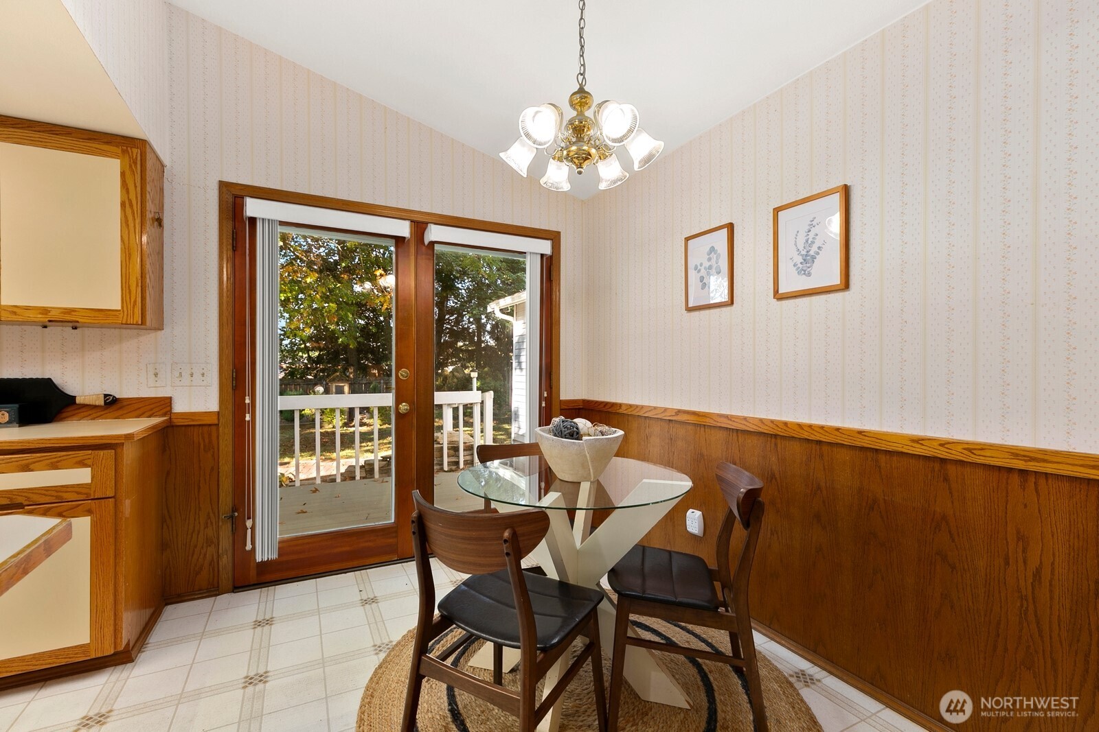 3908 Northeast 10th Street Renton, WA 98056 - Photo 10 of 29 a view of a dining room with furniture and chandelier
