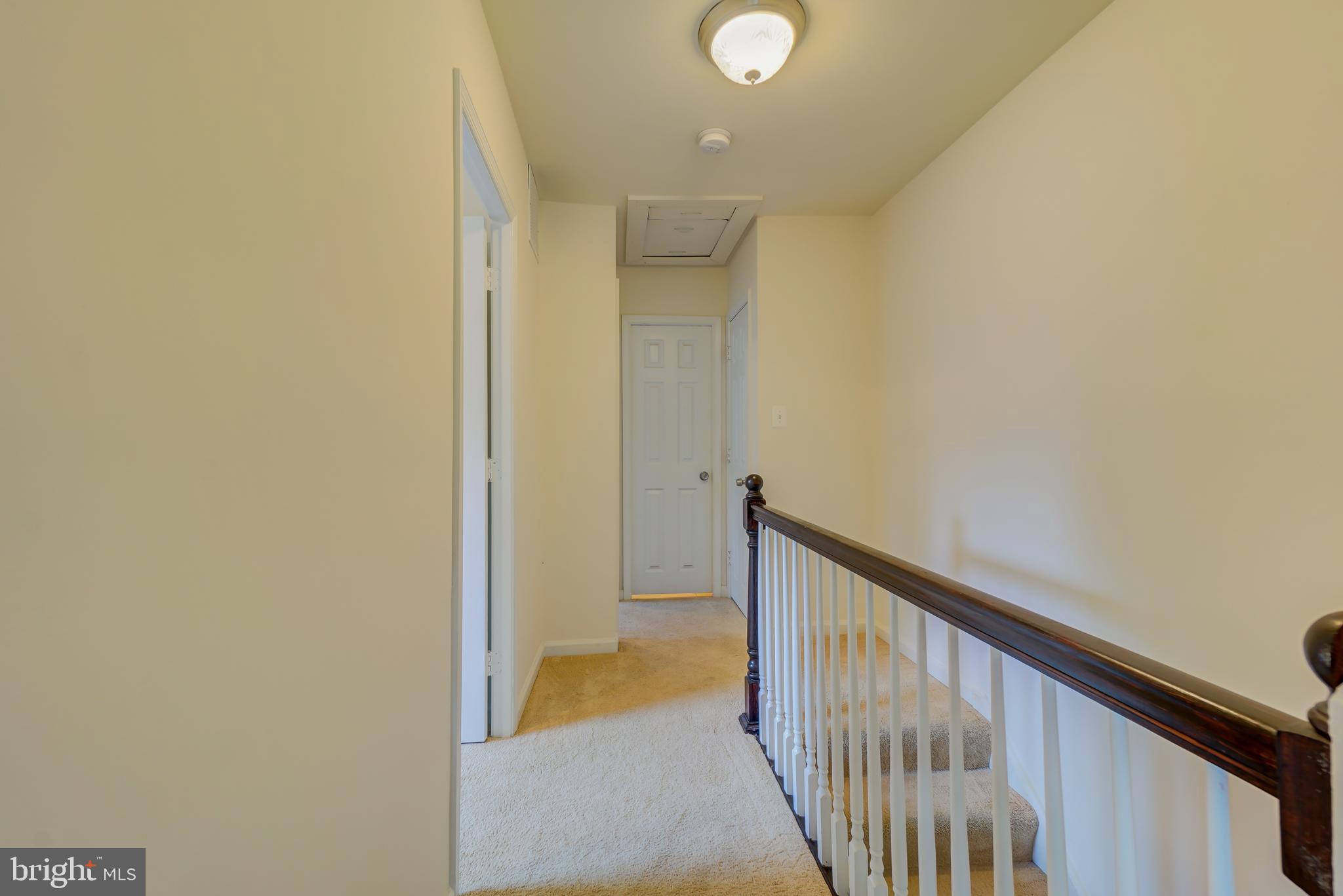 628 Four Mile Road Alexandria, VA 22305 - Photo 22 of 29 a view of a hallway with wooden floor and a window