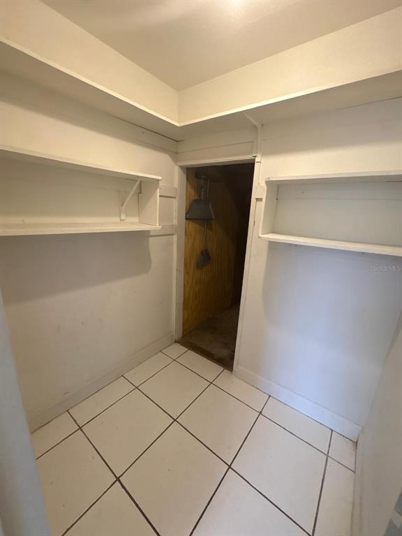 4033 Henley Road, Unit 1707 Orlando, FL 32839 - Photo 45 of 66 a view of walk in closet with empty racks