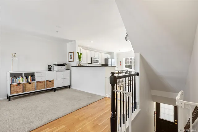 a bedroom with furniture and a wooden floor