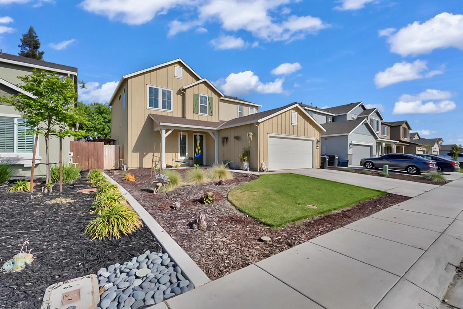 a front view of a house with a yard