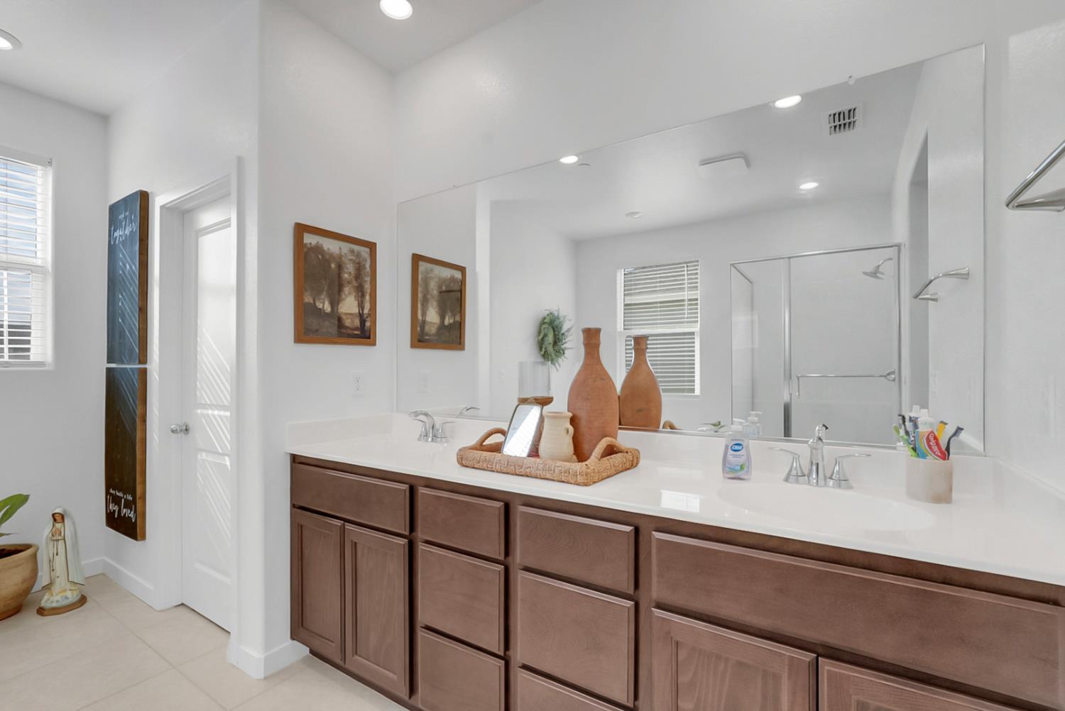 5518 Julia Avenue Keyes, CA 95328 - Photo 12 of 22 a bathroom with a sink double vanity and a mirror