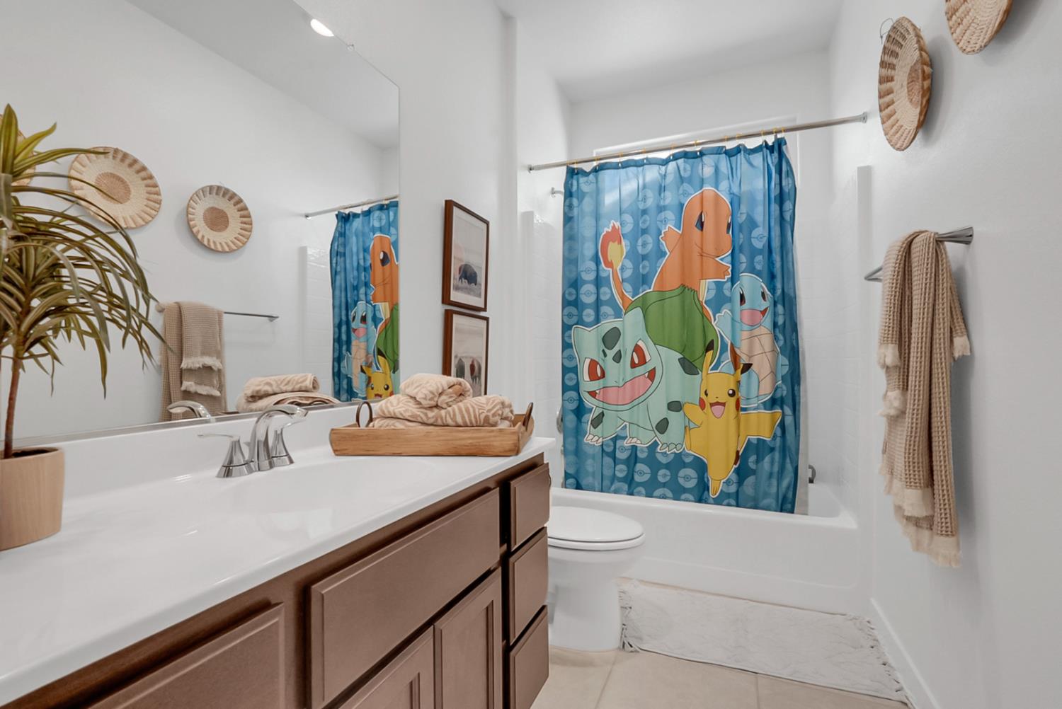 5518 Julia Avenue Keyes, CA 95328 - Photo 14 of 22 a bathroom with a sink a mirror and a shower curtain