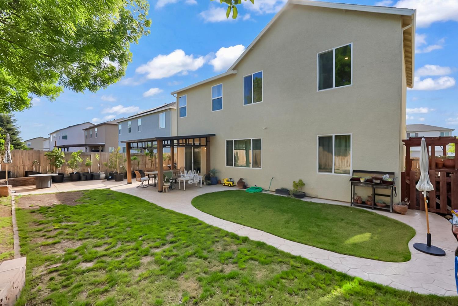 5518 Julia Avenue Keyes, CA 95328 - Photo 16 of 22 a view of a backyard with a patio
