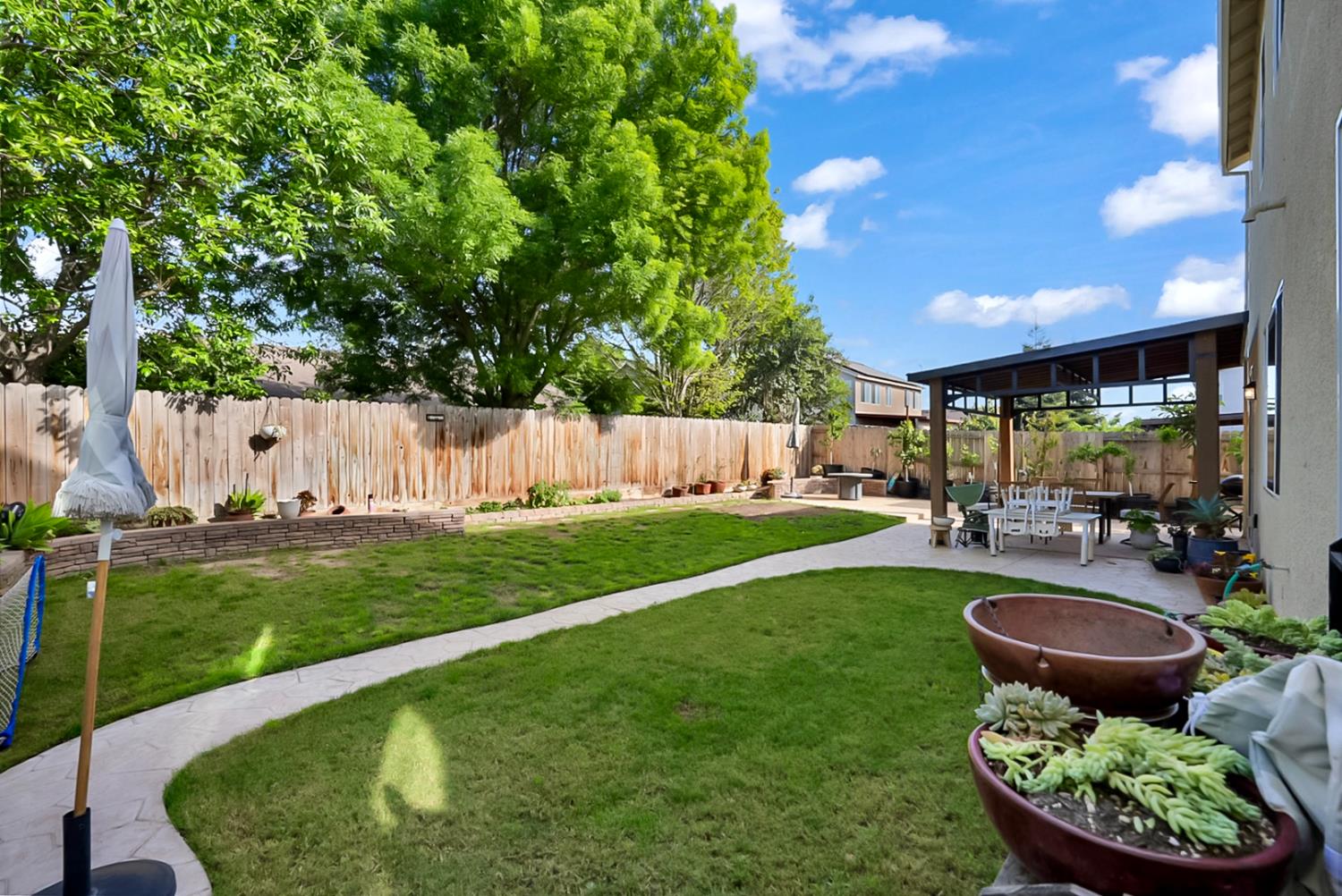 5518 Julia Avenue Keyes, CA 95328 - Photo 17 of 22 a view of an house with backyard and patio
