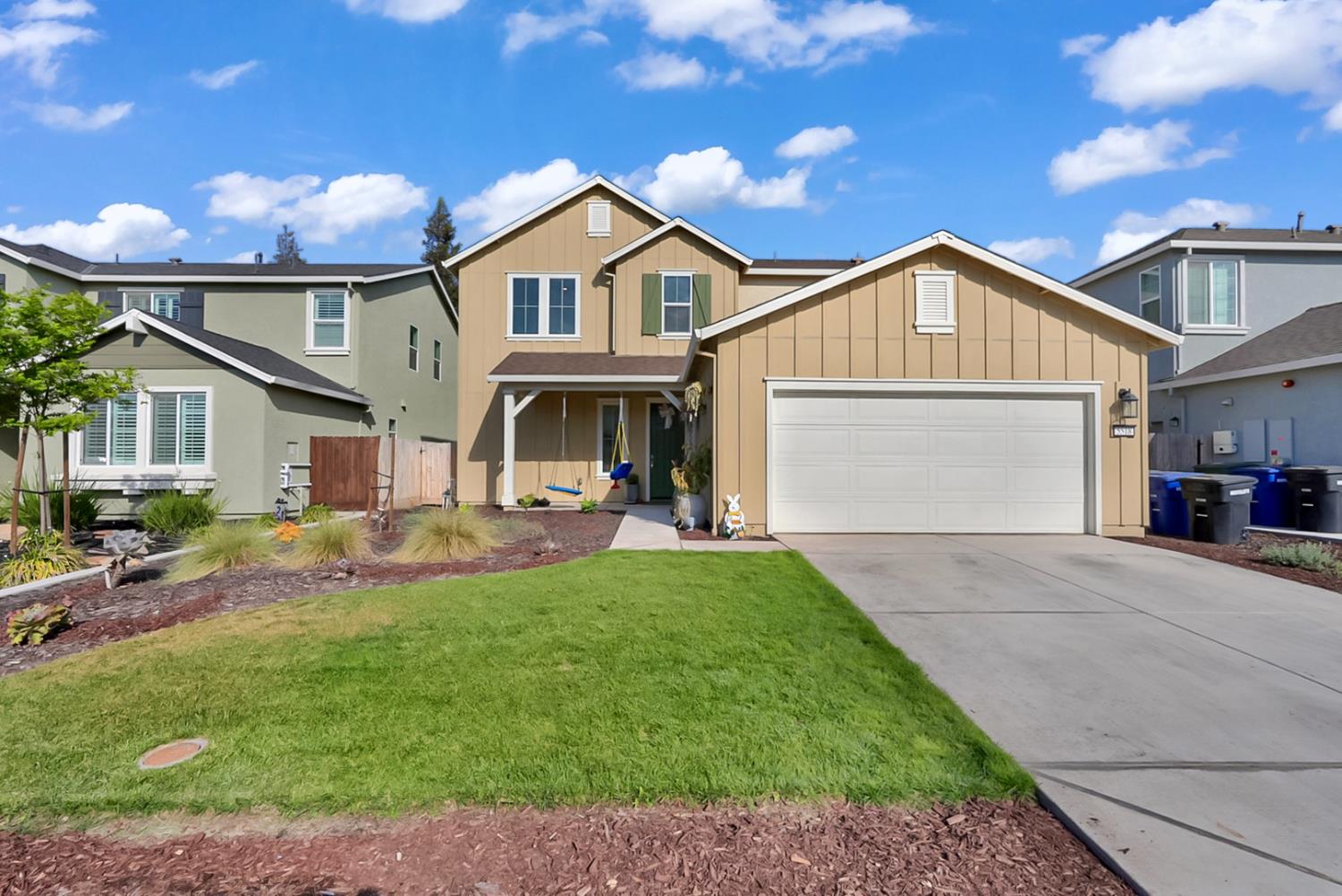 5518 Julia Avenue Keyes, CA 95328 - Photo 22 of 22 a front view of a house with a garden and patio