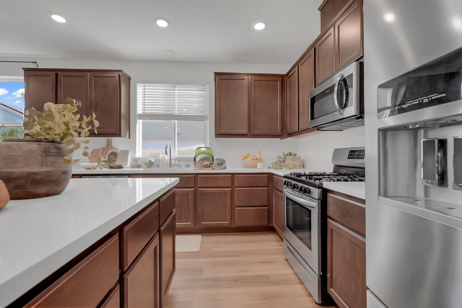 5518 Julia Avenue Keyes, CA 95328 - Photo 5 of 22 a kitchen with stainless steel appliances granite countertop a stove and a sink