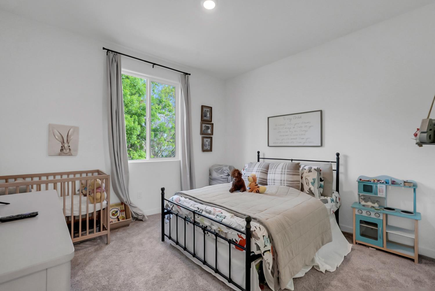 5518 Julia Avenue Keyes, CA 95328 - Photo 6 of 22 a bedroom with a bed and a window