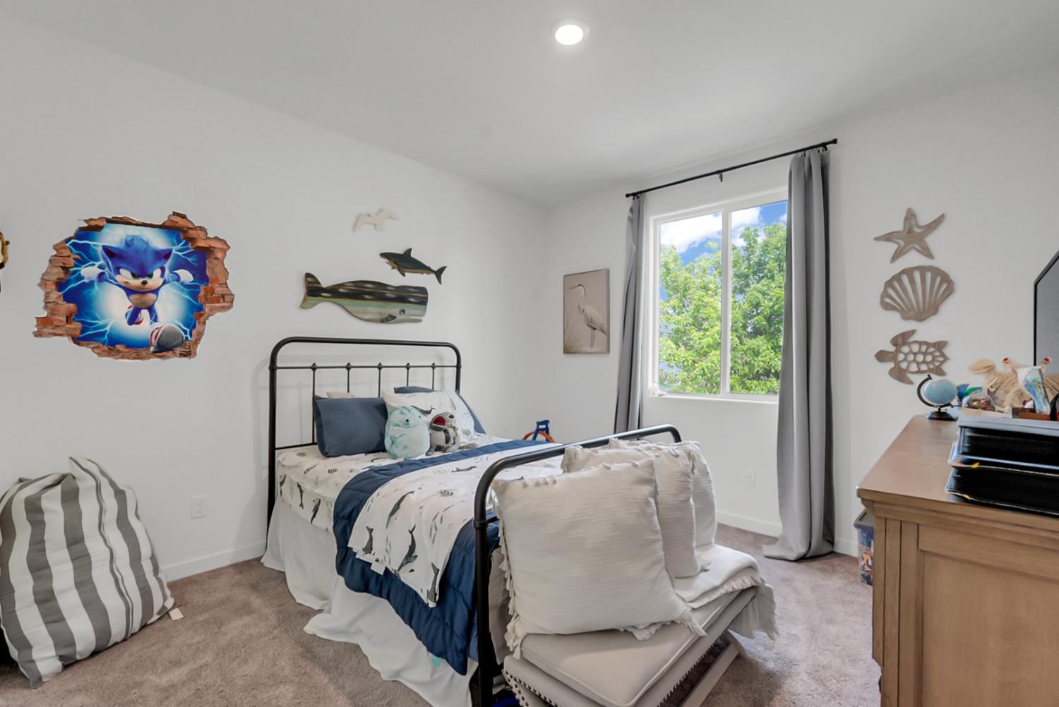 5518 Julia Avenue Keyes, CA 95328 - Photo 7 of 22 a bedroom with a bed and a window