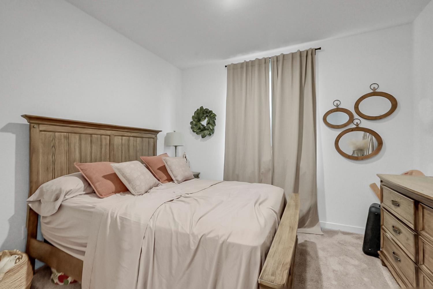 5518 Julia Avenue Keyes, CA 95328 - Photo 8 of 22 a bedroom with a bed and a window