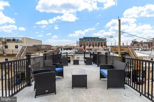 a view of a terrace with outdoor seating