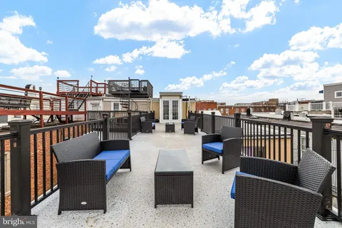 a view of a terrace with outdoor seating