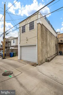 a view of a house with a street