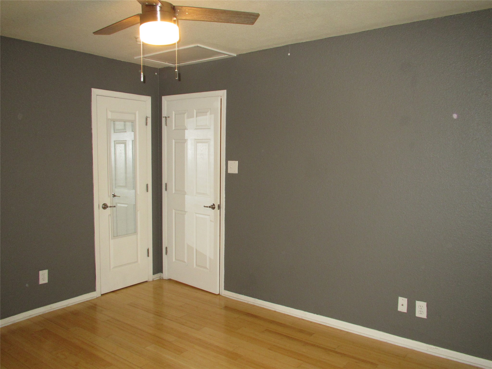 3204 Menchaca Road, Unit 702 Austin, TX 78704 - Photo 11 of 14 Unfurnished room with light wood finished floors and a ceiling fan
