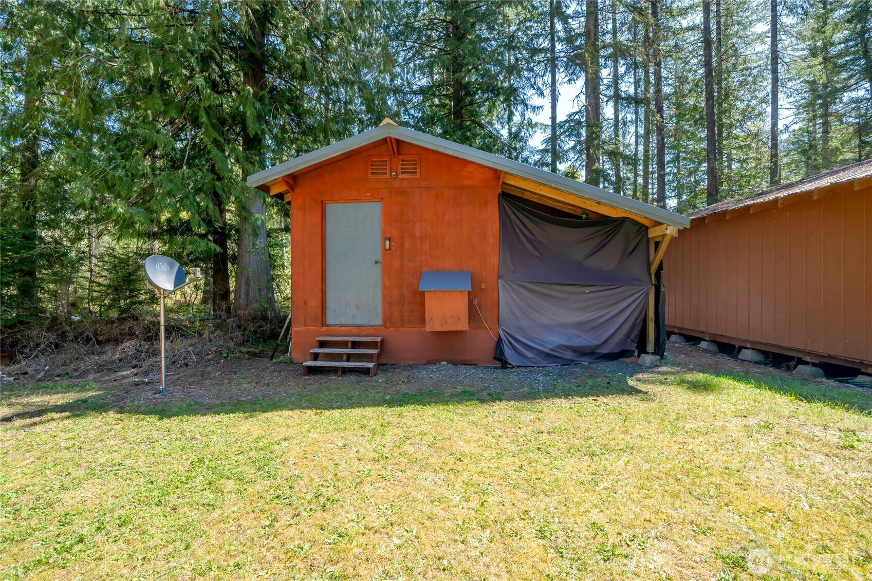 271 Skate Creek Road North Ashford, WA 98304 - Photo 34 of 40 a backyard of a house with barbeque oven