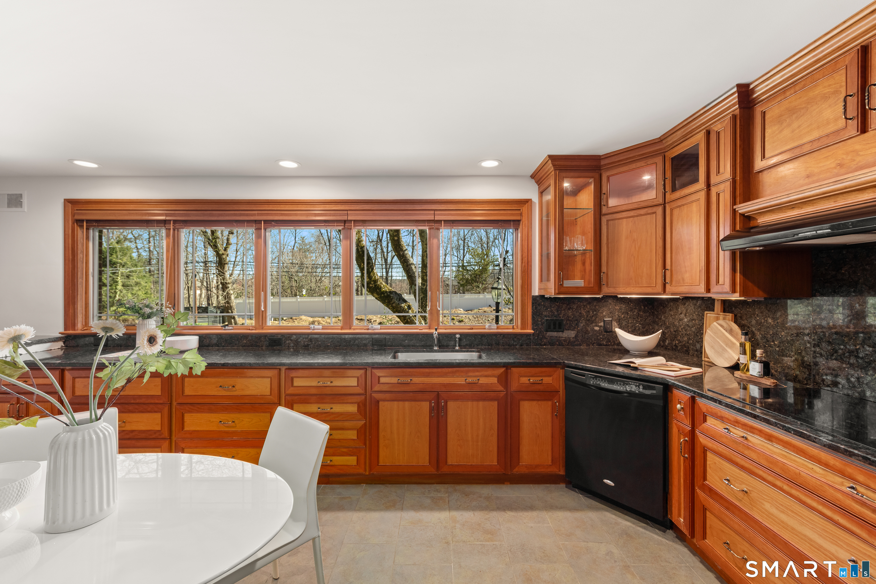 143 Palmer Hill Road Stamford, CT 06902 - Photo 13 of 40 a kitchen with stainless steel appliances granite countertop a sink and a stove