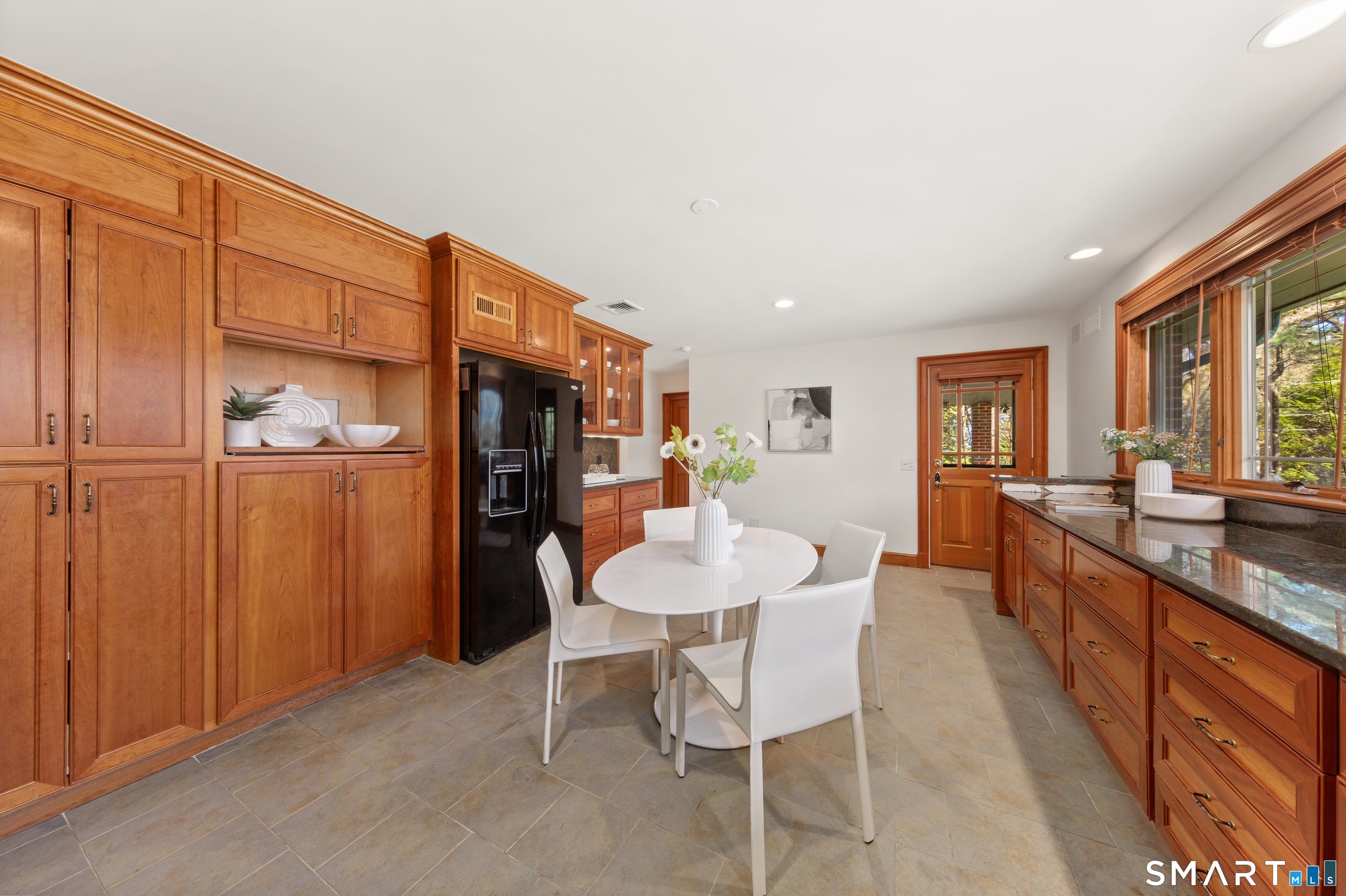 143 Palmer Hill Road Stamford, CT 06902 - Photo 14 of 40 a large kitchen with a table and chairs