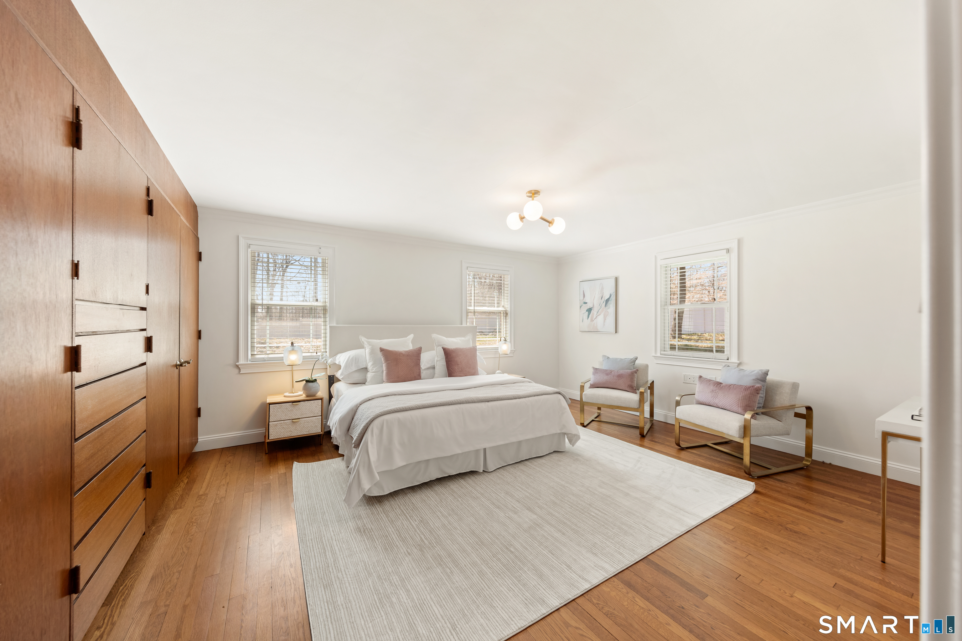 143 Palmer Hill Road Stamford, CT 06902 - Photo 19 of 40 a spacious bedroom with a bed and a couch
