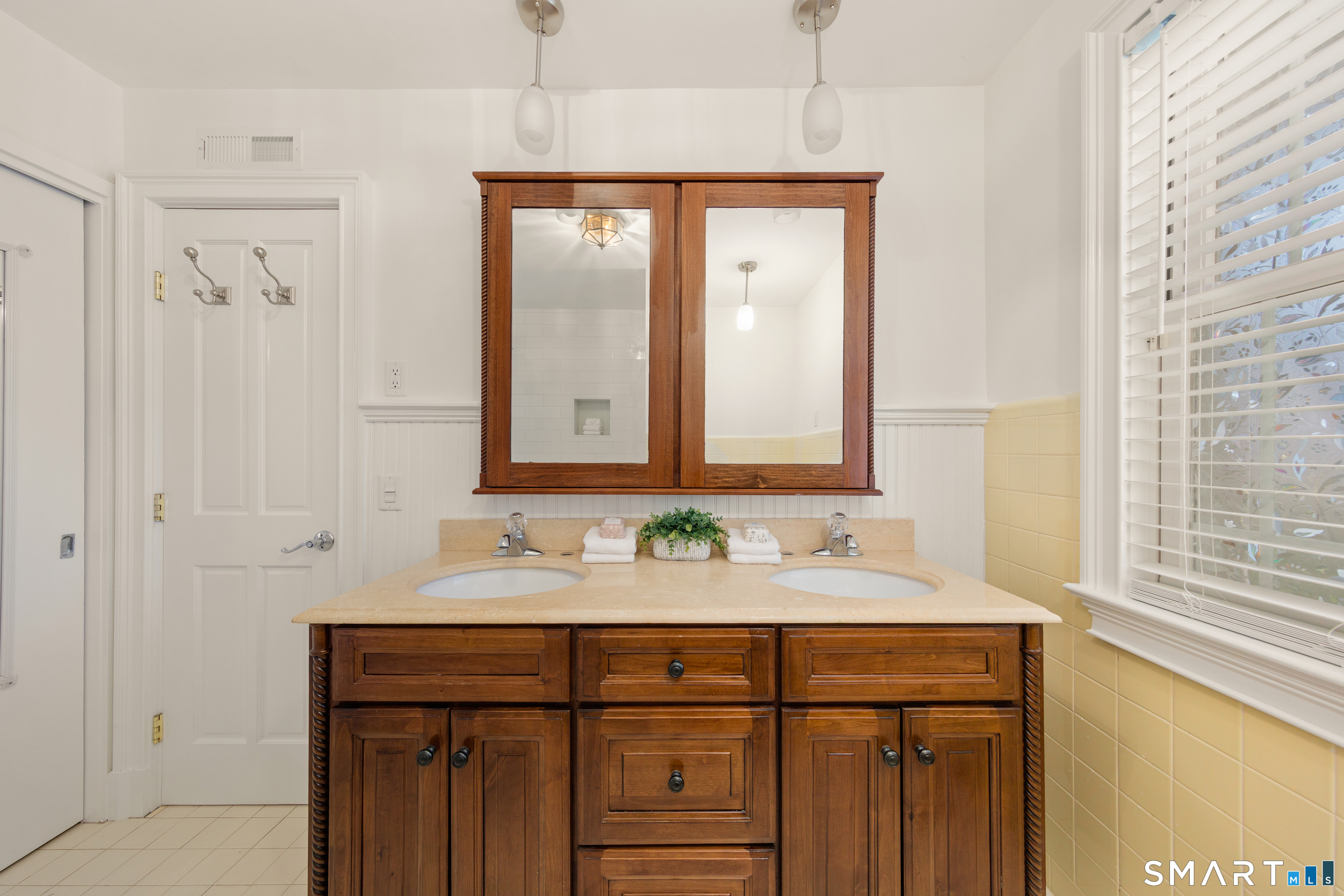143 Palmer Hill Road Stamford, CT 06902 - Photo 22 of 40 a bathroom with a sink and a mirror